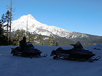 Katie on Snowmobile with Mt Hood in the Background