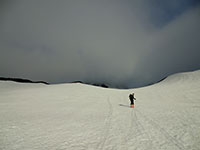Louis Climbing Ever Higher Towards Middle Sister Summit in the Clouds