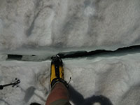 Walking Over a Crevasse on Emmons Glacier