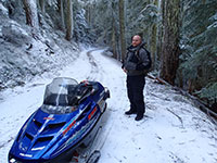John Relaxing While the Snowmobiles Cool Down