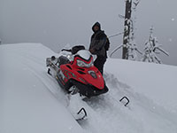 Ryan Snowmobiling near Bennett Pass, Oregon