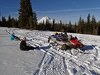 Jordan and John relaxing after snowmobiling to High Prairie