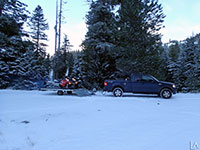 Unloading Polaris snowmobiles near Lookout Mountain