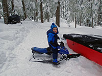 Julian playing on his snow sled