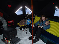 Katie and Julian snuggling on the bunk bed couch