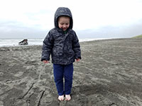 Julian at the beach with the Peter Iredale shipwreck in the background