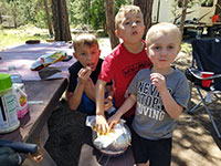Dylan, Shane, and Julian gorging on popcorn