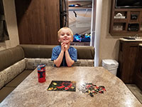 Julian finishing a puzzle