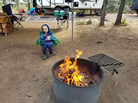 Julian staying warm by the fire