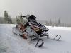 Picture of snow covered snowmobile